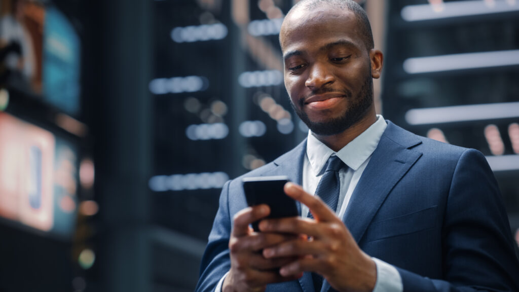 Businessman on smartphone, representing how ChatGPT is disrupting consumer banking