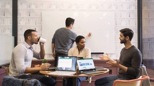 Small conference meeting in modern workspace.